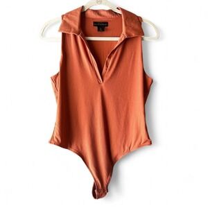 House of Harlow 1960 burnt orange body suit Large $135 new EUC
